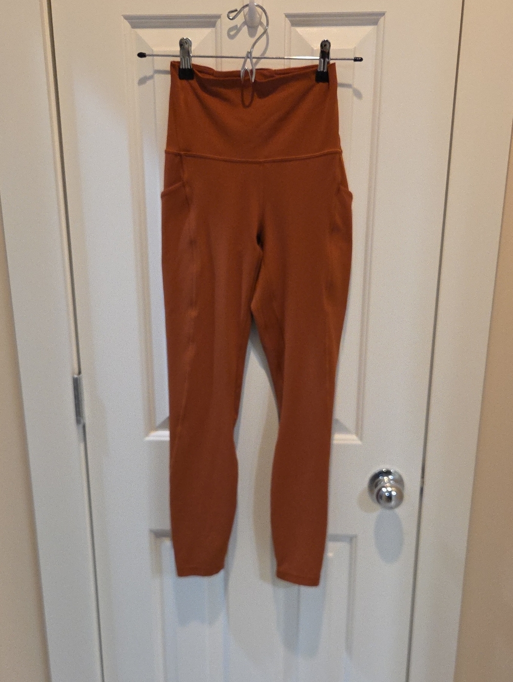 Lululemon Invigorate High-Rise Tight in the color Dark Terracotta.